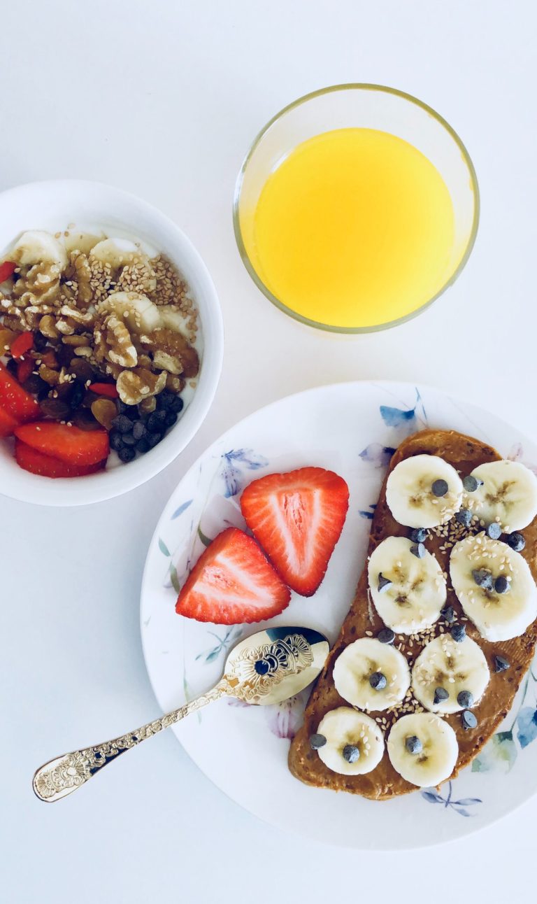 Strawberry Banana Toast: A Burst of Sweetness to Brighten Your Day 1 Healthy breakfast: nut butter banana toast, strawberries, yogurt parfait, and orange juice