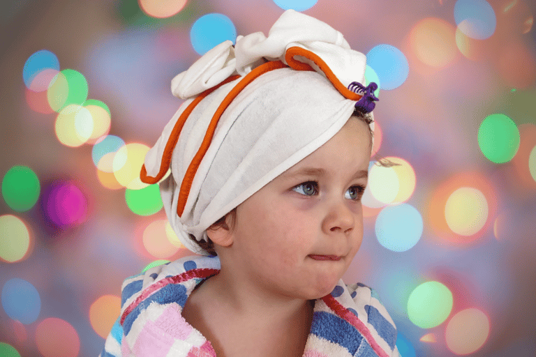 How do I Wash my Toddler's Hair Without Crying 20 Cute toddler with towel turban after bath, colorful bokeh background