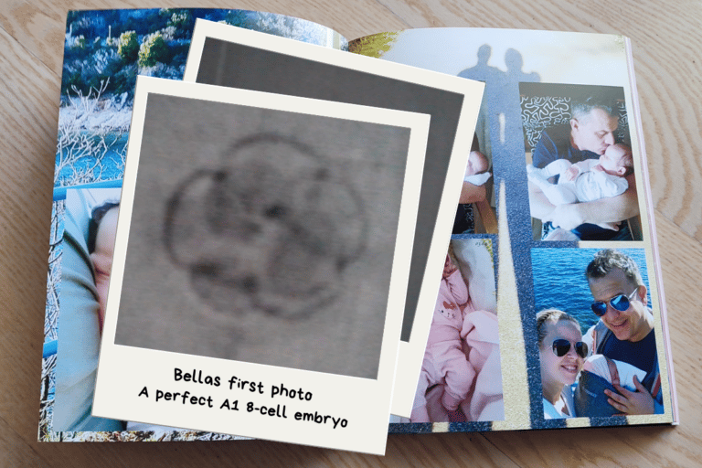 Family photo album with newborn baby pictures and an embryo snapshot on top